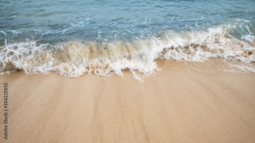 Seascape. Foam waves at sandy beach. Waterscape for background. Soft focus. Motion waves. Copy space. Bingin beach, Bali, Indonesia Seascape. Foam waves at sandy beach. Waterscape for background. Soft focus. Motion waves. Copy space. Bingin beach, Bali, Indonesia