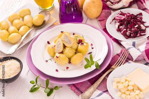 Potato gnocchi stuffed with radicchio and ricotta. 