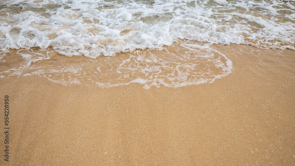 Seascape. Foam waves at sandy beach. Waterscape for background. Soft focus. Motion waves. Copy space. Bingin beach, Bali, Indonesia Seascape. Foam waves at sandy beach. Waterscape for background. Soft focus. Motion waves. Copy space. Bingin beach, Bali, Indonesia