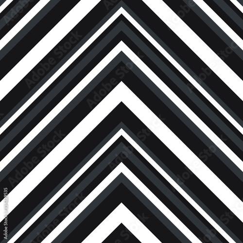 Black and White Chevron Diagonal Stripes seamless pattern background - Black and white Chevron diagonal striped seamless pattern background suitable for fashion textiles, graphics