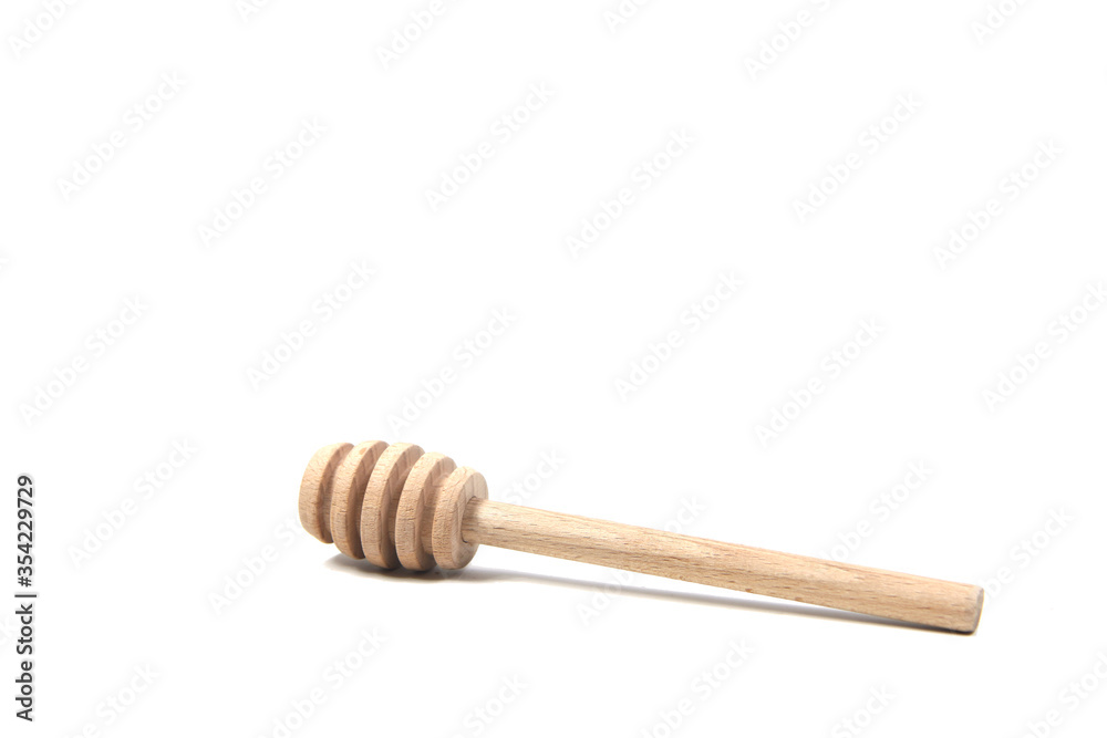 wooden honey spoon isolated on white background wooden honey spoon isolated on white background