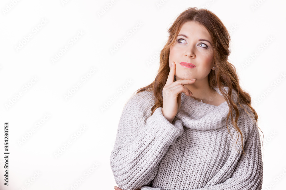 Confused young woman in sweater Confused young woman in sweater