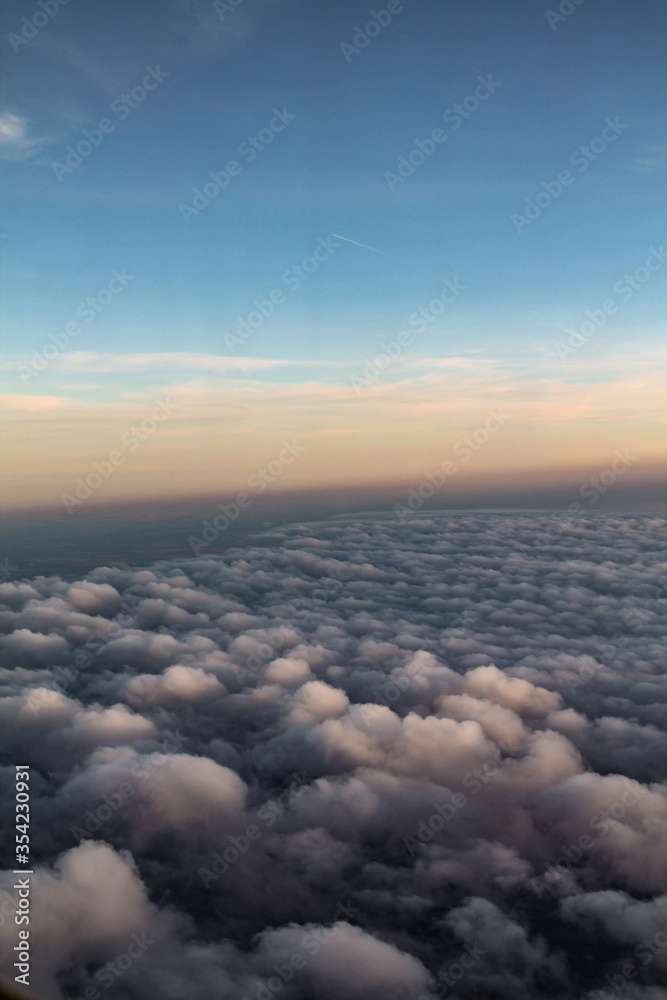 Evening above the clouds, an ocean of soft fluffy