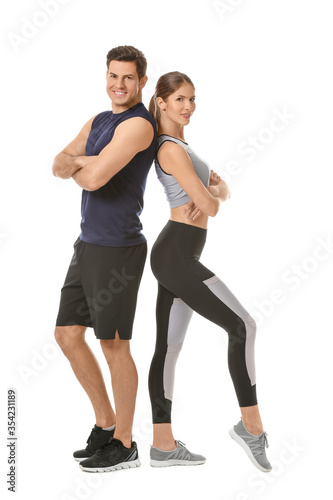 Sporty young couple on white background