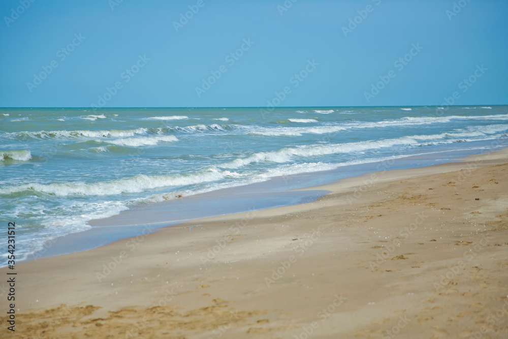 Tropical sea,Beach with Summer time. Close-up photo of beautiful beach with crystal clear turquoise water . Green and sky sea and the waves . Summer vacation background.