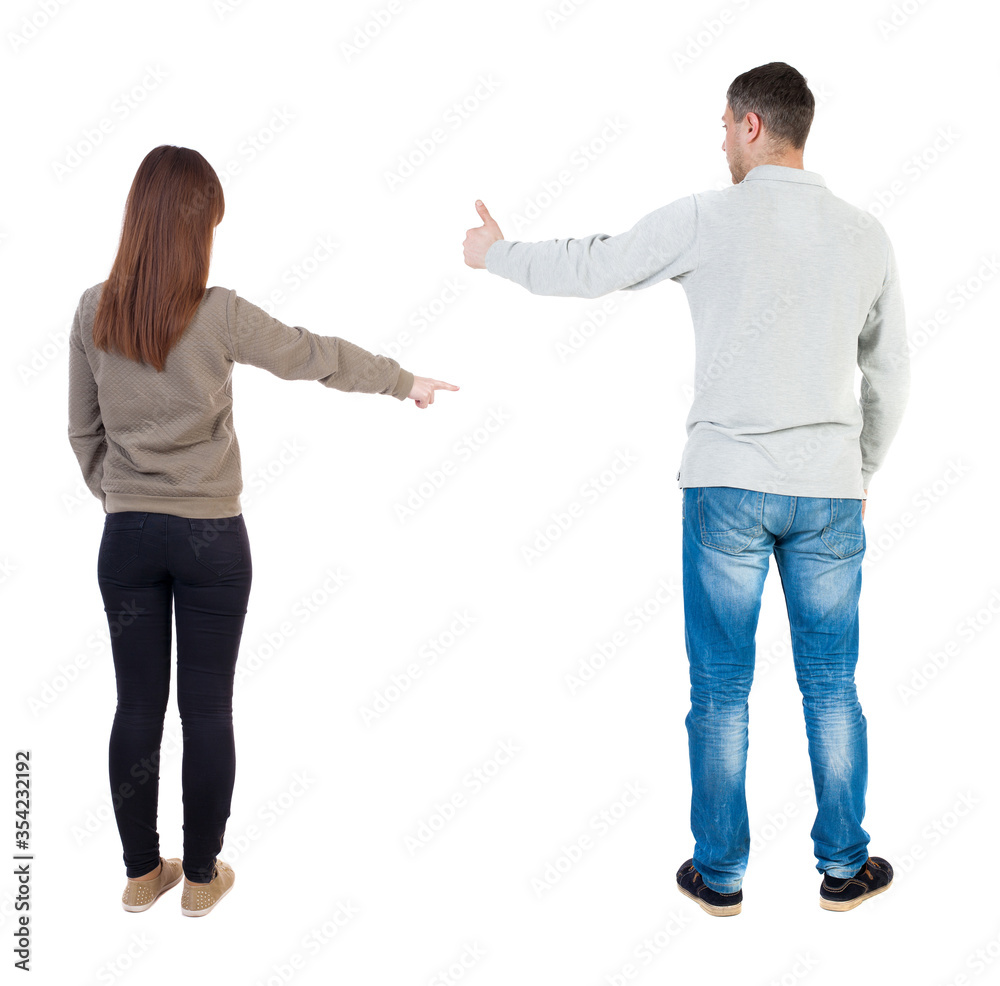 Back view of couple in sweater with mobile phone. Back view of couple in sweater with mobile phone.