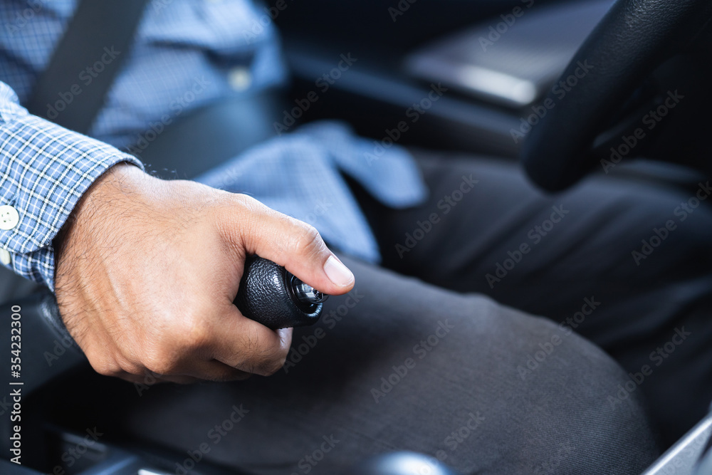 Close up hand push up car handbrake. Safety drive concept. Close up hand push up car handbrake. Safety drive concept.