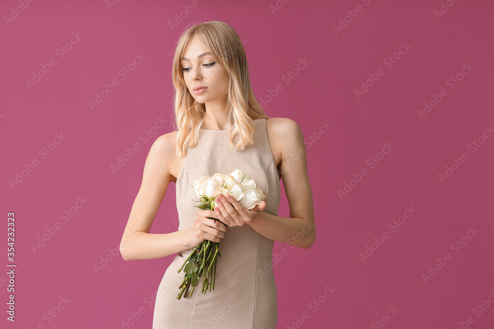 Beautiful young woman with bouquet of roses on color background Beautiful young woman with bouquet of roses on color background
