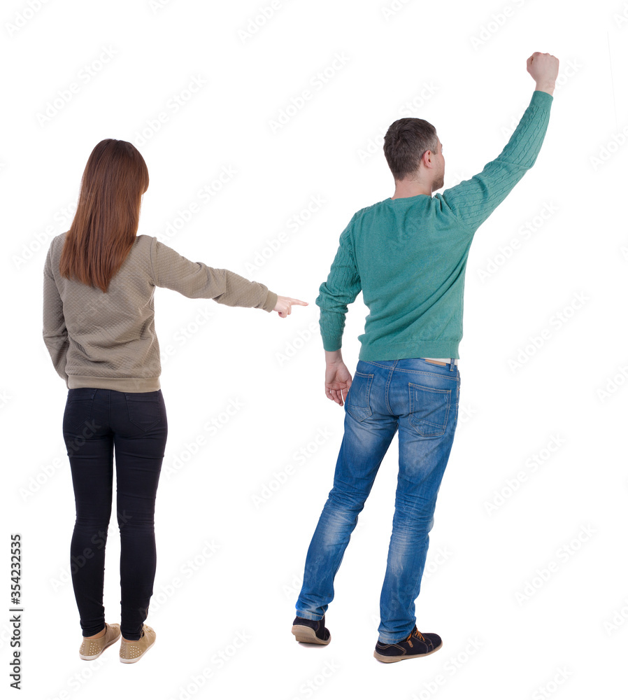 Back view of couple in sweater with mobile phone. Back view of couple in sweater with mobile phone.