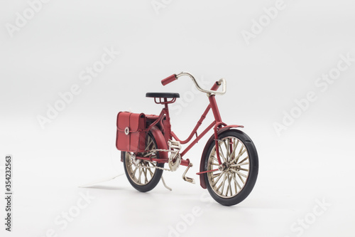 Vintage red bicycle toy Isolated on white background