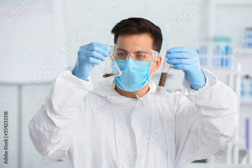 Scientist studying samples ...