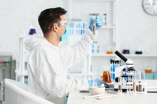 Scientist studying samples ...