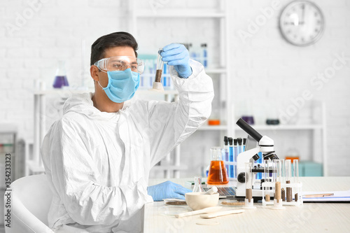 Scientist studying samples ...
