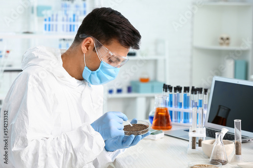 Scientist studying samples ...