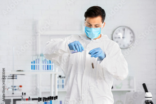 Scientist studying samples ...