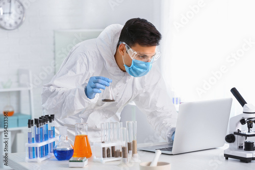 Scientist studying samples ...