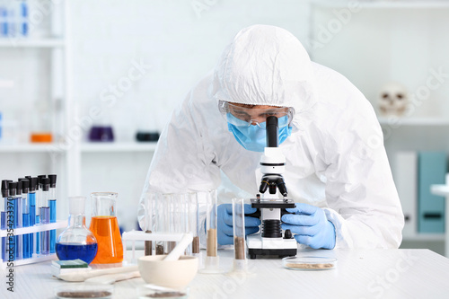 Scientist studying samples ...