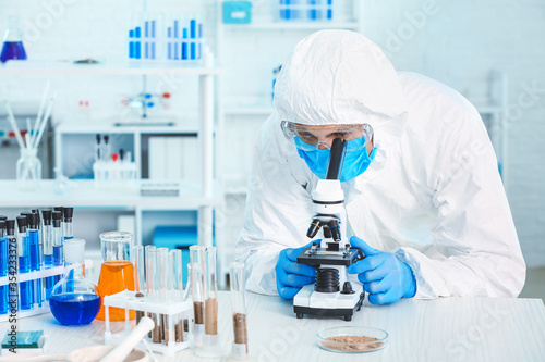 Scientist studying samples ...
