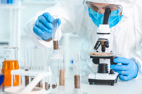 Scientist studying samples ...