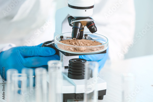 Scientist studying samples ...