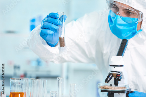 Scientist studying samples ...