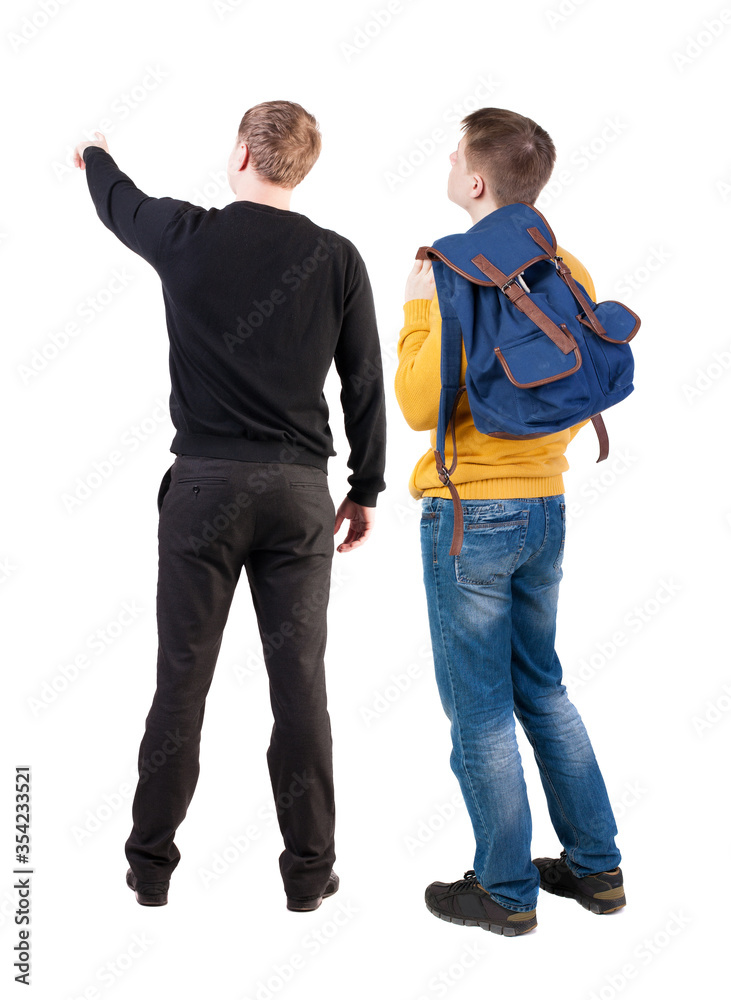 Back view of two man in sweater pointing. Back view of two man in sweater pointing.