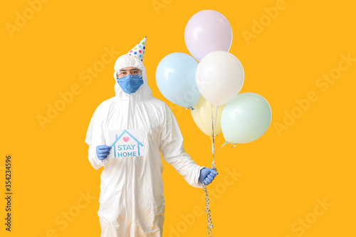 Asian man in biohazard suit...