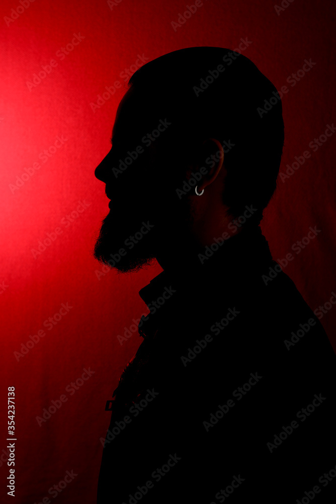 silhouette of a man on a red background