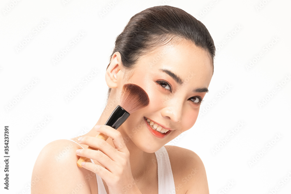 Beauty asian woman hold make up brush  and cheerful with make up brush