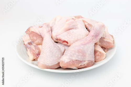 Raw chicken on white background