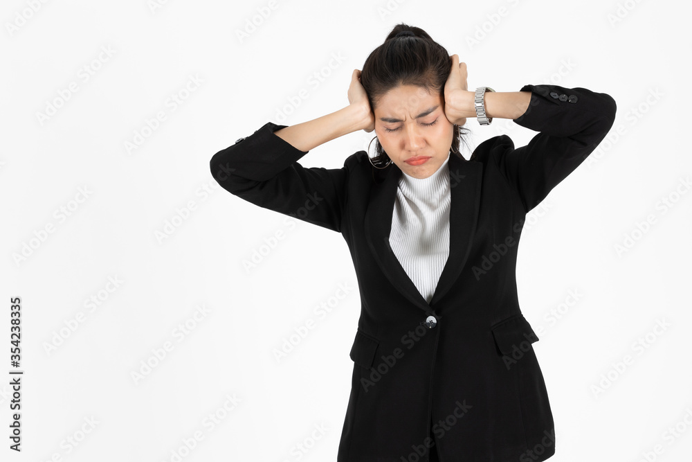 Depressed upset young Asain business woman in suit suffering from severe depression and burnout over white isolated background. Failure and layoff concept. Depressed upset young Asain business woman in suit suffering from severe depression and burnout over white isolated background. Failure and layoff concept.
