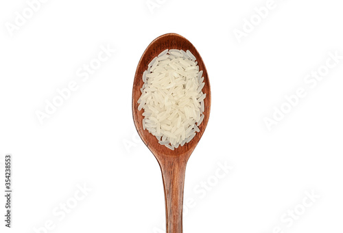 Wooden spoon and white rice on an isolated background