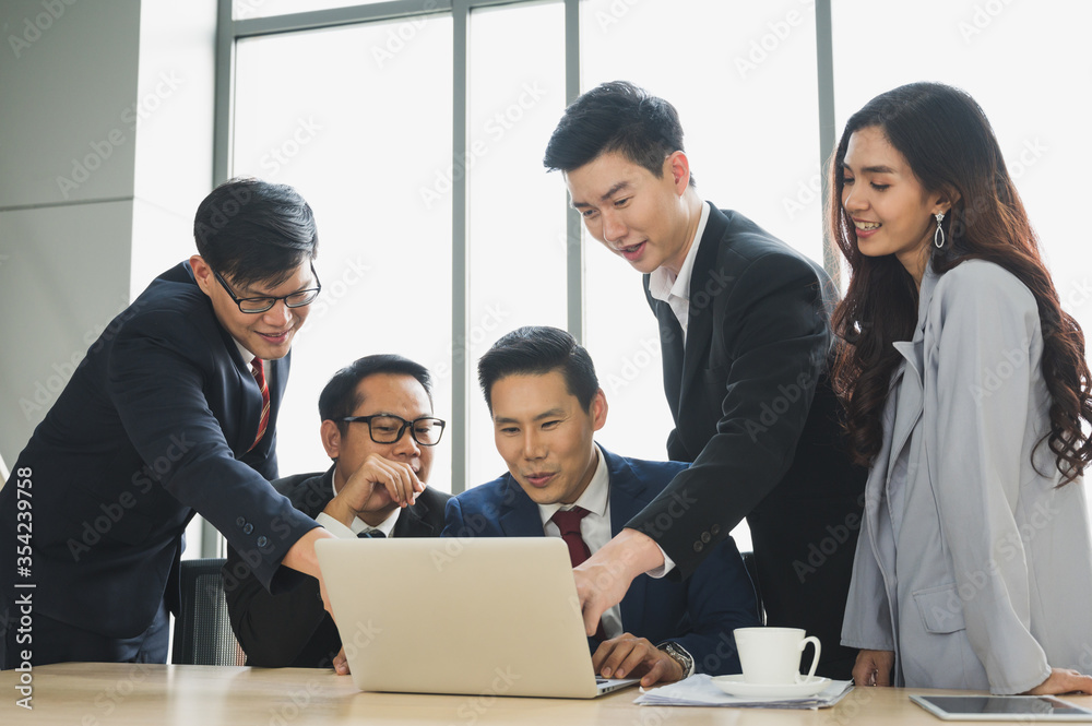 Asian business people team analyzing statistics financial. Team of businesspeople Meeting Conference Discussion Corporate Concept in office. Asian business people team analyzing statistics financial. Team of businesspeople Meeting Conference Discussion Corporate Concept in office.
