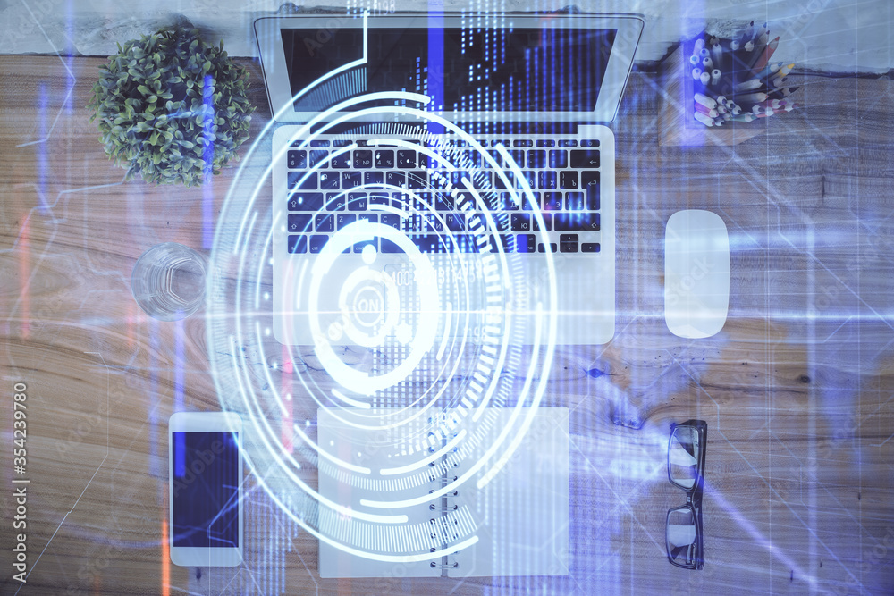Double exposure of data theme drawing hologram over topview work table background with computer. Concept of technology. Double exposure of data theme drawing hologram over topview work table background with computer. Concept of technology.