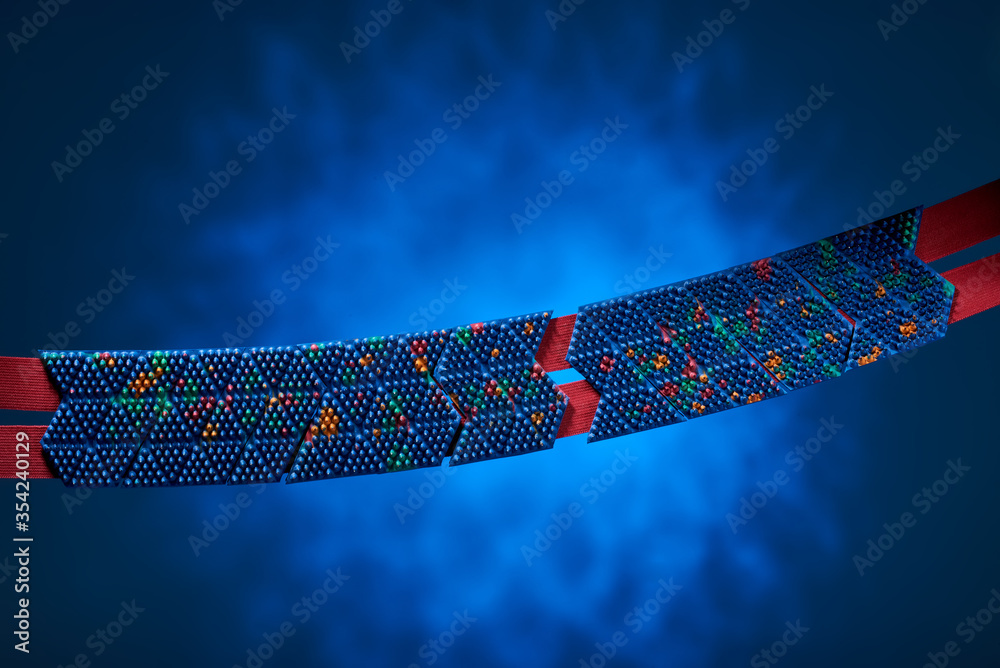 The massage belt is blue, with red stripes, hanging in the air against a spotty blue background. For relaxation and health. Advertising, thematic and subject shooting.