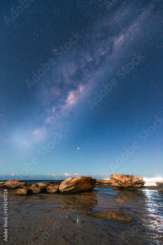 Milky way view over the rocky coastline of Coalcliff, NSW, Australia. © AlexandraDaryl