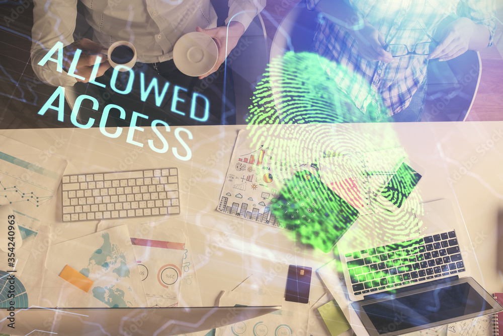Double exposure of man and woman working together and fingerprint drawing. Computer background. Top View. Security concept. Double exposure of man and woman working together and fingerprint drawing. Computer background. Top View. Security concept.