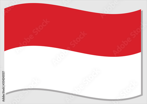 Waving flag of Indonesia vector graphic. Waving Indonesian flag illustration. Indonesia country flag wavin in the wind is a symbol of freedom and independence.