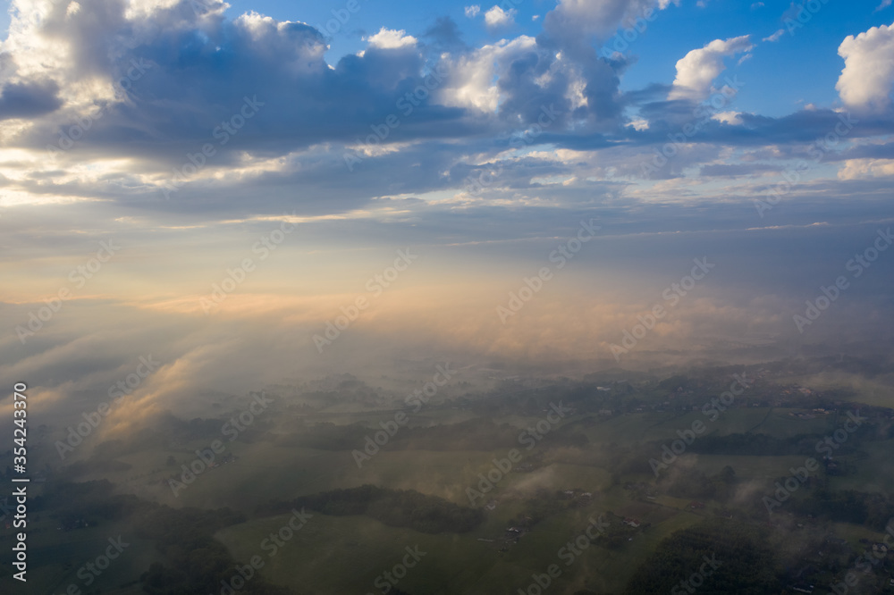 Summer nature landscape aerial panorama with sunrise. Morning fog and sunrise, meadow and forest and field. Summer nature landscape aerial panorama with sunrise. Morning fog and sunrise, meadow and forest and field.