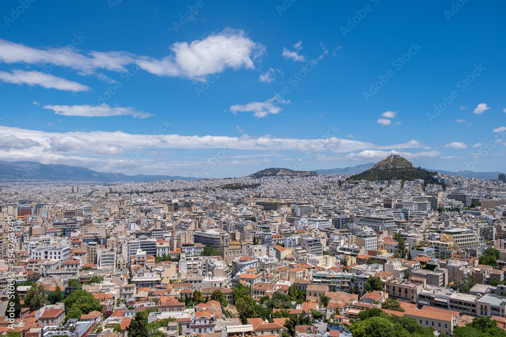 Mount Lycabettus and Athens cityscape view from Acropolis hill in Greece, blue sky, sunny day.