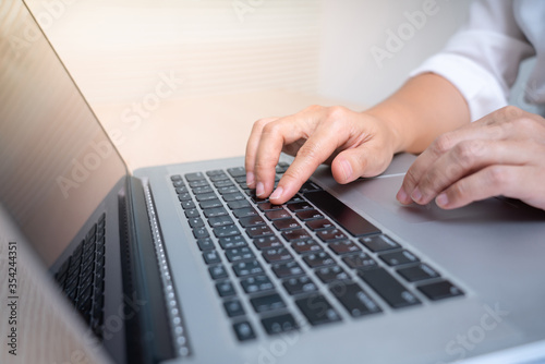 woman's hands using laptop.business concept.Select focus