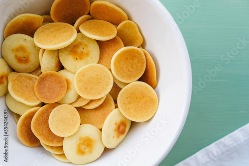 Delicious freshly cooked pancake cereal in a bowl, top view.