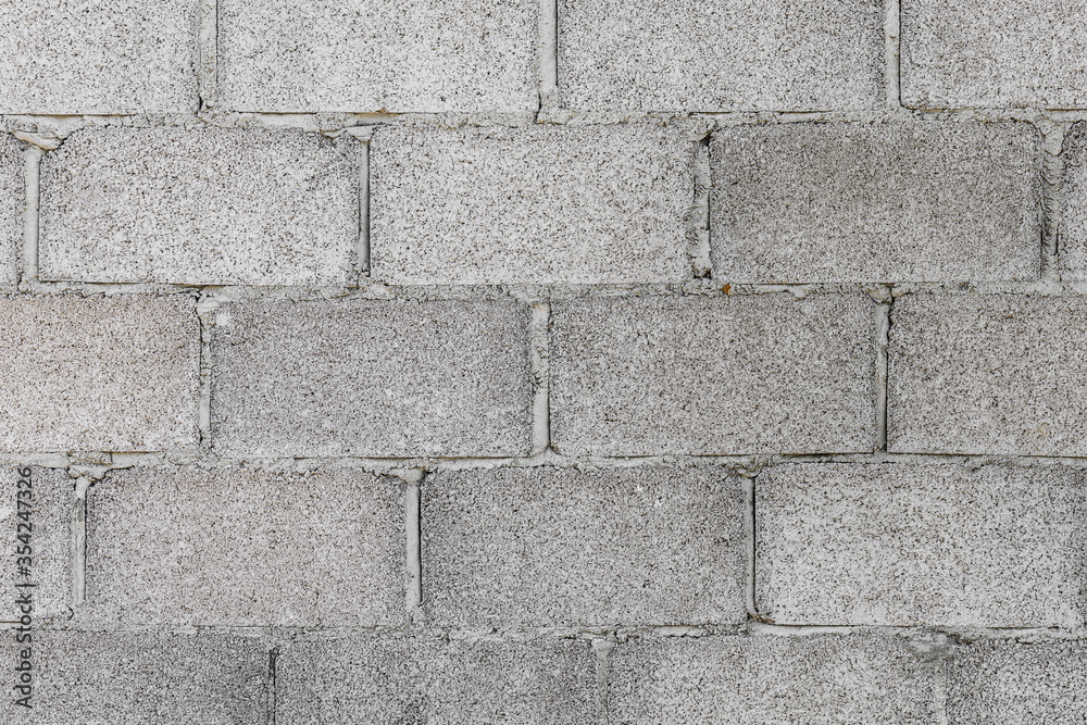 Obraz premium Background of grey blocks in construction area. Wall of concrete block.