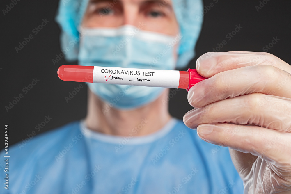 Male doctor demonstrating positive coronavirus test Male doctor demonstrating positive coronavirus test