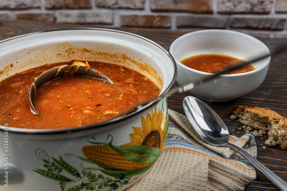 Red soup with vegetables and meat, tasty, traditional Ukrainian borsch, close-up, shallow depth of field, selective focus. Healthy Organic Homemade Food Concept Red soup with vegetables and meat, tasty, traditional Ukrainian borsch, close-up, shallow depth of field, selective focus. Healthy Organic Homemade Food Concept