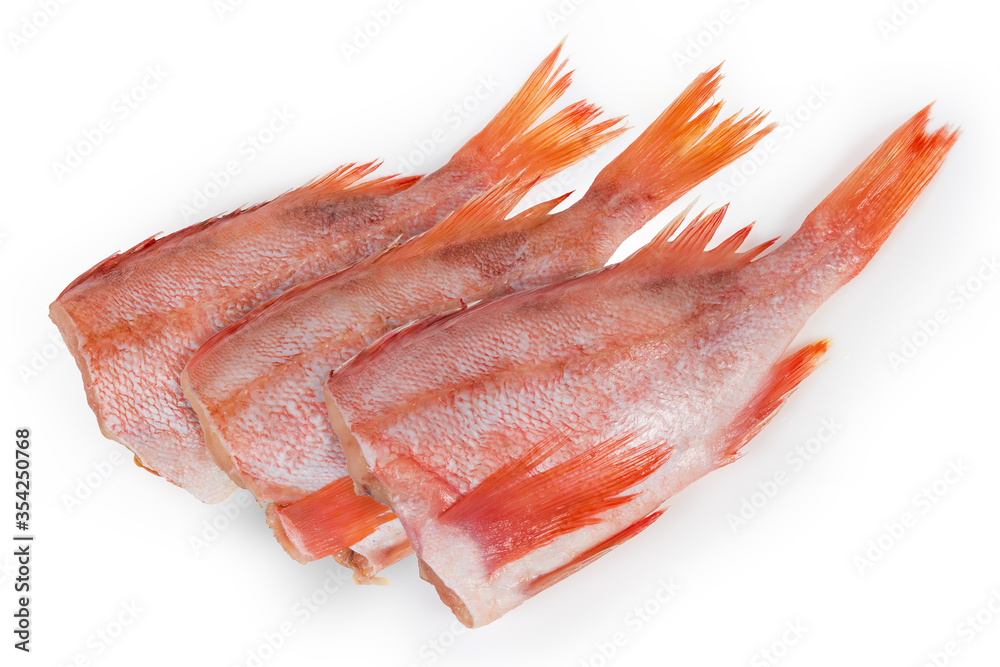 Raw headless gutted carcass of redfish on a white background Raw headless gutted carcass of redfish on a white background