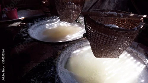 The Making of SinThao Salt at Ancient Mountain Rock Salt Pond (Bo Kluea) In Nan Province, Northern Of Thailand photo