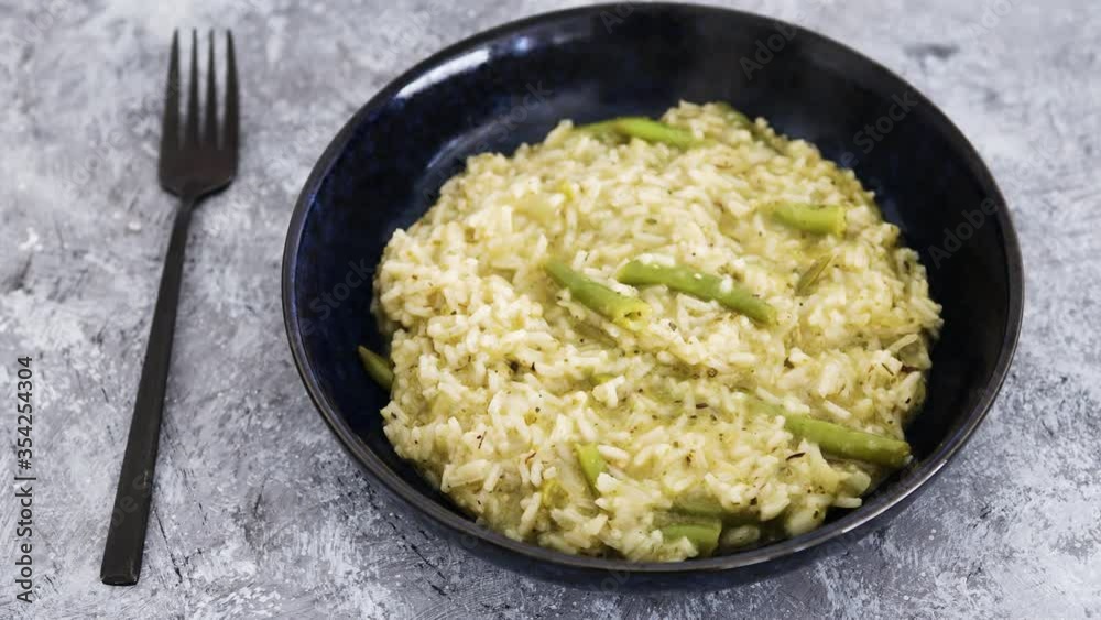 creamy vegan pesto risotto with green beans handheld camera creamy vegan pesto risotto with green beans handheld camera