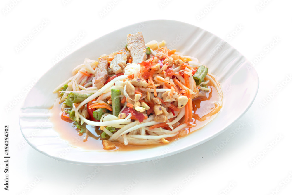 Grilled Pork Salad Thai food served Tradition northeast food Isaan delicious with fresh vegetables - Hot and Spicy Slice grilled pork menu Asian food isolated on white background. With clipping path..