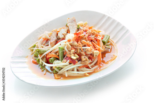 Grilled Pork Salad Thai food served Tradition northeast food Isaan delicious with fresh vegetables - Hot and Spicy Slice grilled pork menu Asian food isolated on white background. With clipping path..